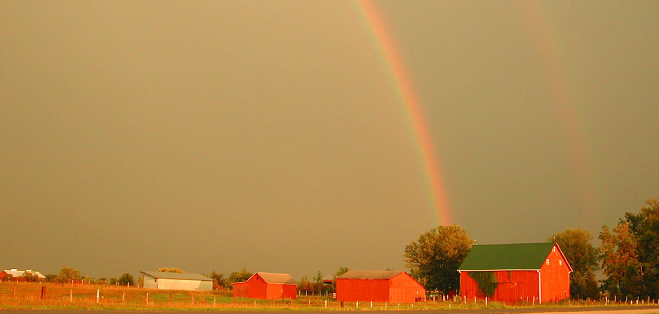 Rainbow over a barn 